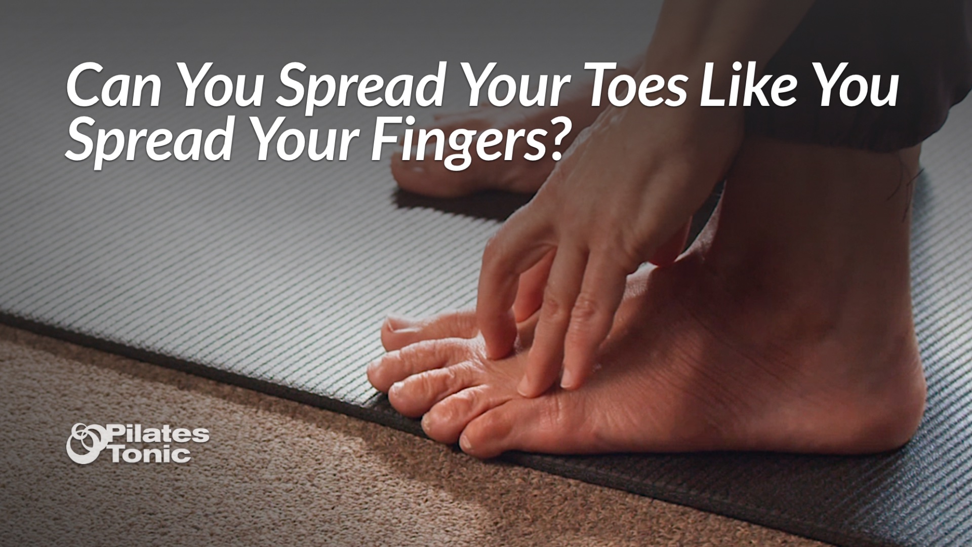 Person sitting on exercise mat demonstrating toe spreading exercise with hand placed over foot to guide toe mobility movement